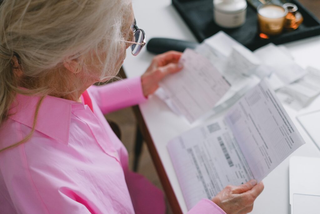 Elderly lady reviewing her estate planning documents.