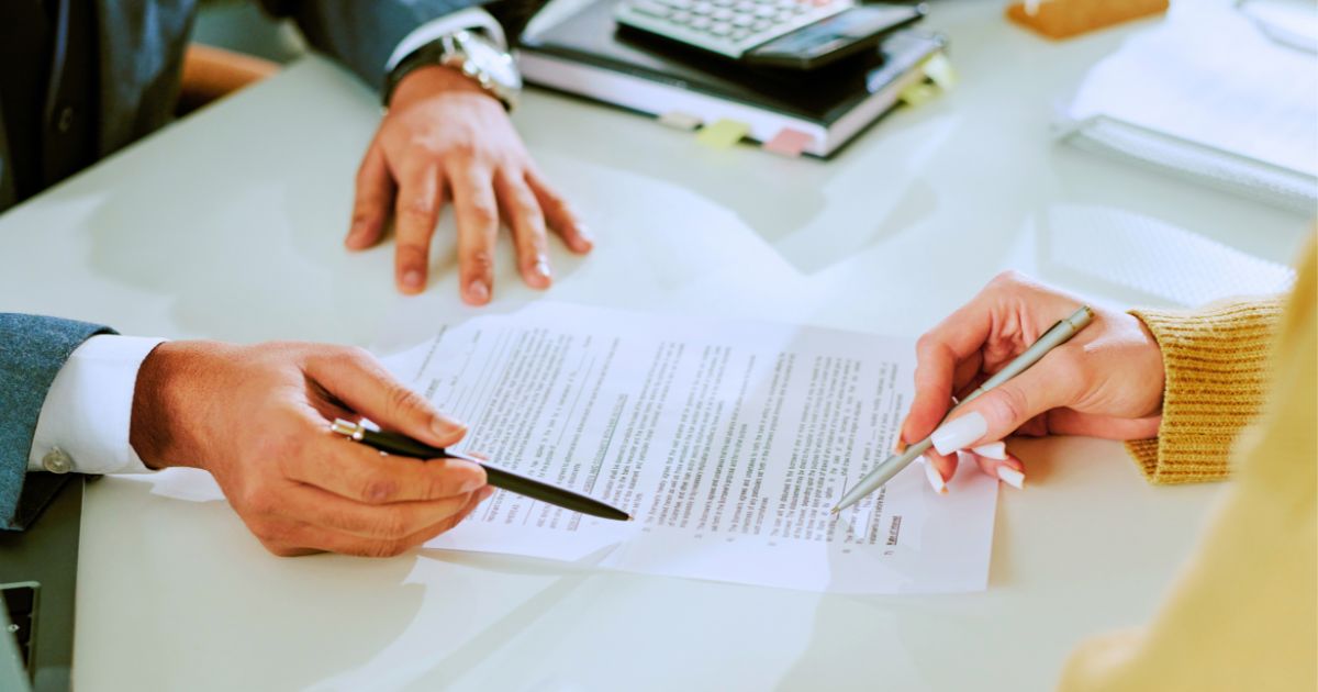 Attorney and client reviewing legal plan